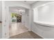 Hallway leads to an open plan living room and outdoor patio at 25425 N 64Th Ave, Phoenix, AZ 85083
