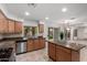 Kitchen with granite countertops, stainless steel appliances and backyard views at 25425 N 64Th Ave, Phoenix, AZ 85083
