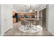 Charming kitchen with wood cabinets, stainless steel appliances, and an adjacent dining area, perfect for casual meals at 25425 N 64Th Ave, Phoenix, AZ 85083