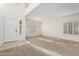 Spacious living room with large shuttered windows and a stained glass window beside the front door at 25425 N 64Th Ave, Phoenix, AZ 85083