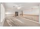 Open loft area with natural light from large windows and ceiling fan at 25425 N 64Th Ave, Phoenix, AZ 85083