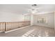 Spacious loft with ceiling fan and natural light from windows with shutter blinds at 25425 N 64Th Ave, Phoenix, AZ 85083