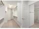 Spacious walk-in closet with carpet, built-in shelves and a clothes rod at 25425 N 64Th Ave, Phoenix, AZ 85083