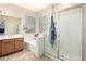 Bright bathroom featuring a soaking tub, a separate shower, and a double vanity at 25695 W Crown King Rd, Buckeye, AZ 85326