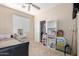 Bedroom with carpet flooring, and a bed with neutral walls, also included is a desk and shelving unit at 25695 W Crown King Rd, Buckeye, AZ 85326