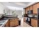 Well-equipped kitchen with granite countertops, tile backsplash, and stainless steel appliances at 25695 W Crown King Rd, Buckeye, AZ 85326