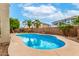 Sparkling pool in private backyard with desert landscaping and mature palm trees at 25695 W Crown King Rd, Buckeye, AZ 85326