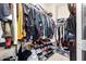 Spacious walk-in closet with clothing racks, shelves, and plenty of storage space for shoes and accessories at 25695 W Crown King Rd, Buckeye, AZ 85326