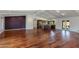 Bright open-concept living area with wood floors and modern design at 302 E Carol Ann Way, Phoenix, AZ 85022