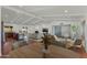 Spacious living area with wood floors, ample seating, and natural light at 302 E Carol Ann Way, Phoenix, AZ 85022