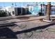 The backyard has two storage sheds, decorative rock and drip system landscaping at 303 S Recker Rd # 62, Mesa, AZ 85206