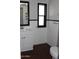 Well-lit bathroom featuring modern fixtures, wainscotting, and neutral decor at 303 S Recker Rd # 62, Mesa, AZ 85206