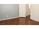 This bedroom has laminate flooring and a door opening into a hallway at 303 S Recker Rd # 62, Mesa, AZ 85206