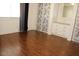 This bedroom has laminate flooring, a closet with patterned sliding doors, and natural light at 303 S Recker Rd # 62, Mesa, AZ 85206
