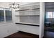 The dining area is complete with shelving and a stylish light fixture at 303 S Recker Rd # 62, Mesa, AZ 85206