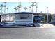 This home's exterior features a carport, desert landscaping, and covered patio at 303 S Recker Rd # 62, Mesa, AZ 85206