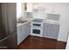 Updated kitchen features new appliances, elegant cabinets, and stylish backsplash details at 303 S Recker Rd # 62, Mesa, AZ 85206