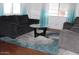 Cozy living room featuring comfortable seating, a stylish rug, and plenty of natural light at 303 S Recker Rd # 62, Mesa, AZ 85206