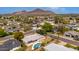 Aerial view of a single-Gathering home with a swimming pool, mature trees, and desert landscaping at 4249 E Mitchell Dr, Phoenix, AZ 85018