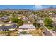 Aerial view of homes in a suburban neighborhood with mature landscaping and desert landscaping at 4249 E Mitchell Dr, Phoenix, AZ 85018