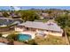 An aerial view of a backyard pool and hot tub with views of the surrounding neighborhood at 4249 E Mitchell Dr, Phoenix, AZ 85018