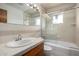 A basic bathroom featuring a vanity and a shower-tub at 4249 E Mitchell Dr, Phoenix, AZ 85018