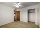 A basic bedroom featuring neutral paint and a ceiling fan at 4249 E Mitchell Dr, Phoenix, AZ 85018