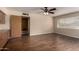 Neutral bedroom featuring hardwood floors, a ceiling fan, and neutral paint at 4249 E Mitchell Dr, Phoenix, AZ 85018