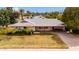 Exterior of the single-story home with a front lawn and covered carport at 4249 E Mitchell Dr, Phoenix, AZ 85018