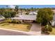 Exterior of the single-story home with a front lawn and long driveway at 4249 E Mitchell Dr, Phoenix, AZ 85018