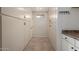 A hallway with storage featuring white cabinets at 4249 E Mitchell Dr, Phoenix, AZ 85018