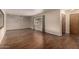 Spacious living room features hardwood floors, neutral paint, decorative lighting, and a bright window at 4249 E Mitchell Dr, Phoenix, AZ 85018
