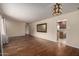 Spacious living room features hardwood floors, neutral paint, decorative lighting, and an open floorplan at 4249 E Mitchell Dr, Phoenix, AZ 85018