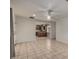 Bright living room featuring tile floors and a view to the kitchen at 4249 E Mitchell Dr, Phoenix, AZ 85018