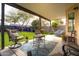 Covered patio with outdoor seating, a decorative rug, and a view of the green backyard at 4945 E Shapinsay Dr, San Tan Valley, AZ 85140