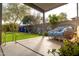 Inviting covered patio with wicker sofa, perfect for outdoor relaxation and enjoying the backyard at 4945 E Shapinsay Dr, San Tan Valley, AZ 85140