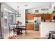 Bright kitchen with stainless steel appliances and a cozy breakfast nook with a round table and bay window at 4945 E Shapinsay Dr, San Tan Valley, AZ 85140