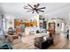 Open-concept living room featuring hardwood floors, recessed lighting, and a ceiling fan at 4945 E Shapinsay Dr, San Tan Valley, AZ 85140