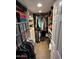 Walk-in closet with custom shelving, storage, and hanging rods at 5110 N 31St Way # 345, Phoenix, AZ 85016