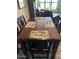 Dining area features a wooden table with seating, and view into living space at 5110 N 31St Way # 345, Phoenix, AZ 85016