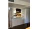 View of a kitchen with stainless steel appliances and dark cabinetry from dining room at 5110 N 31St Way # 345, Phoenix, AZ 85016