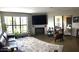 Living room features a large window, fireplace, tv and comfortable seating at 5110 N 31St Way # 345, Phoenix, AZ 85016
