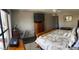 Bright main bedroom featuring a desk and large TV at 5110 N 31St Way # 345, Phoenix, AZ 85016