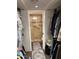 Shower with glass door, tile surround, grab bar, and shower chair at 5110 N 31St Way # 345, Phoenix, AZ 85016