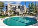 Community pool with lounge chairs perfect for relaxation and enjoying the sun at 5110 N 31St Way # 345, Phoenix, AZ 85016