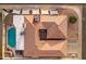 Overhead shot of a beautiful home featuring a private pool, a covered patio, and well-kept landscaping at 5431 W Cochise Dr, Glendale, AZ 85302