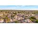 Expansive aerial shot showcasing a vibrant neighborhood with diverse housing styles and mature trees at 5431 W Cochise Dr, Glendale, AZ 85302