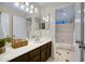 Bright bathroom offers a large mirror and vanity with ample counter space at 5431 W Cochise Dr, Glendale, AZ 85302