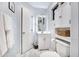 Clean bathroom with storage cabinet above toilet and modern vanity at 5431 W Cochise Dr, Glendale, AZ 85302