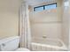Clean, bright bathroom with tiled shower and tub combination at 5431 W Cochise Dr, Glendale, AZ 85302